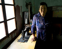 Henry's mother with manual operated sewing machine